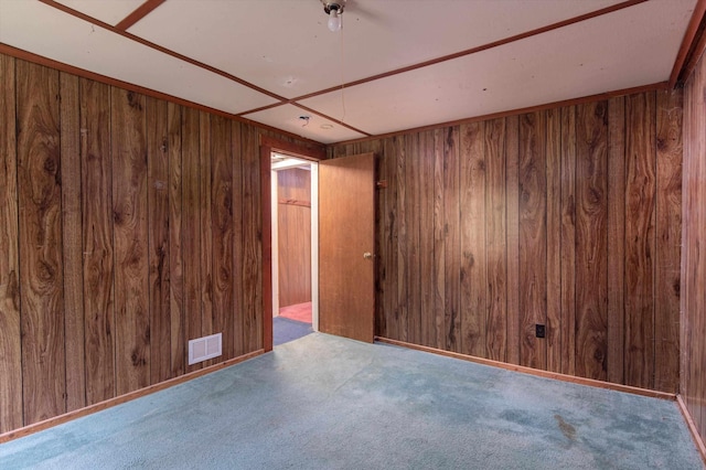143 Okemo Acres, Ludlow, VT 05149 - unfurnished room featuring wood walls and carpet
