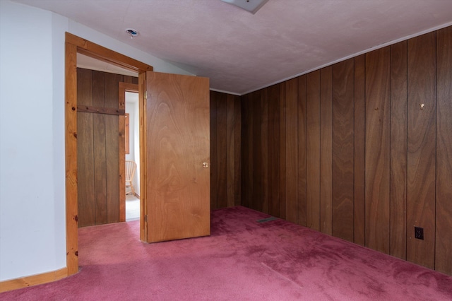 143 Okemo Acres, Ludlow, VT 05149 - spare room with carpet and wood walls