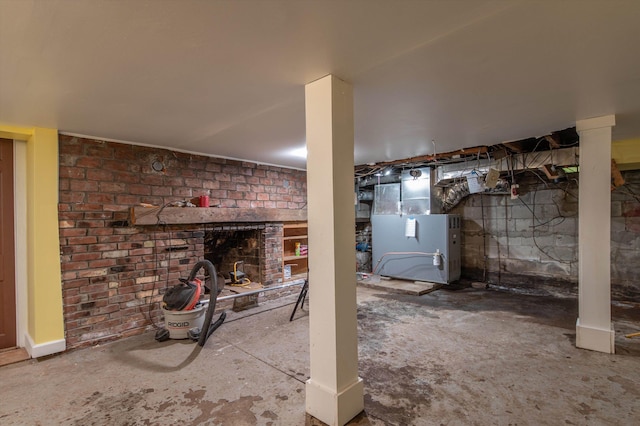 143 Okemo Acres, Ludlow, VT 05149 - basement featuring a brick fireplace and heating unit