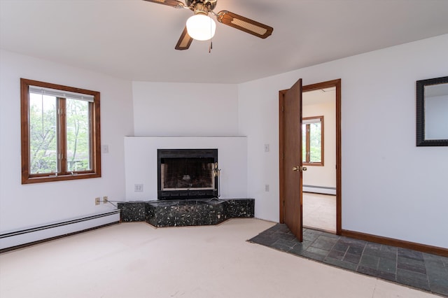 143 Okemo Acres, Ludlow, VT 05149 - unfurnished living room with baseboard heating, a baseboard heating unit, a fireplace with raised hearth, ceiling fan, and carpet