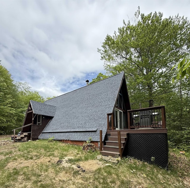9 Spruce Rd, Middleton, NH 03887 - view of side of home with a deck and roof with shingles
