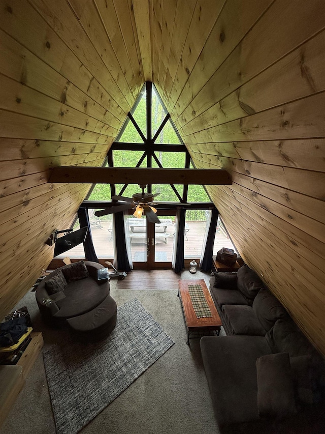 9 Spruce Rd, Middleton, NH 03887 - living area with wood ceiling, lofted ceiling, ceiling fan, and wooden walls
