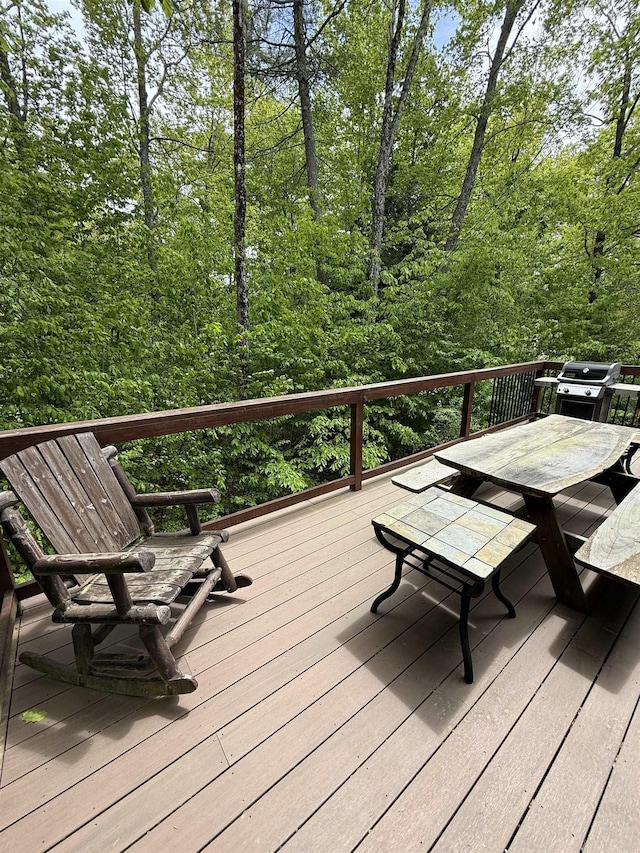 9 Spruce Rd, Middleton, NH 03887 - wooden deck with area for grilling and outdoor dining space