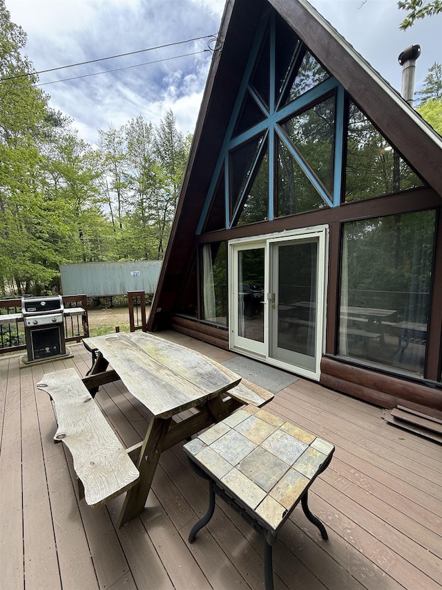 9 Spruce Rd, Middleton, NH 03887 - wooden terrace featuring a grill and outdoor dining space