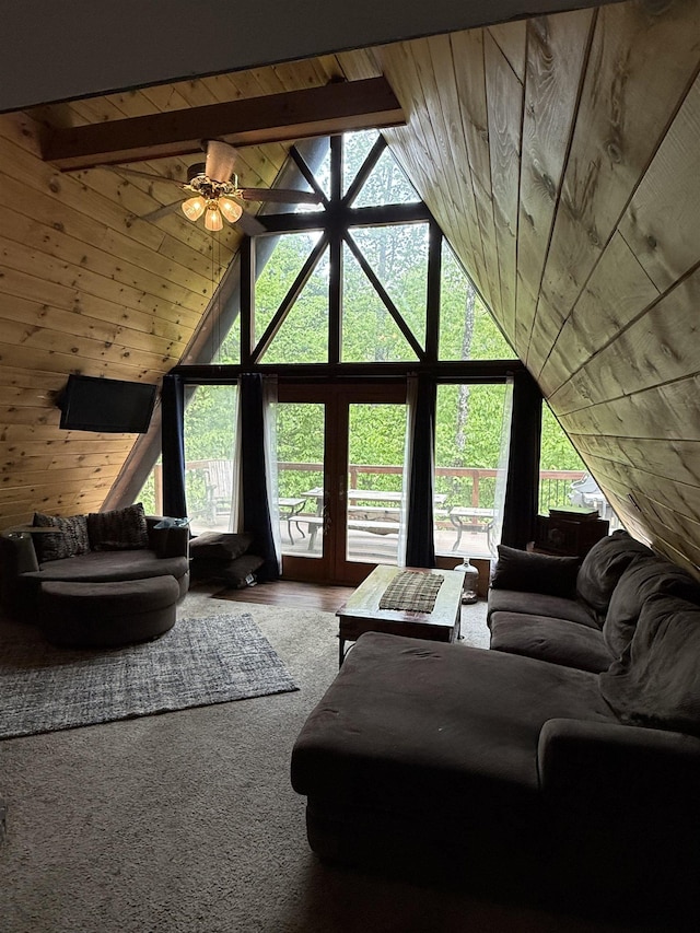 9 Spruce Rd, Middleton, NH 03887 - living room featuring plenty of natural light, high vaulted ceiling, wood ceiling, a ceiling fan, and wood walls