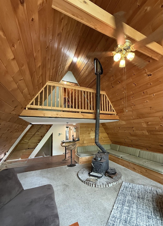 9 Spruce Rd, Middleton, NH 03887 - living area with a wood stove, wooden ceiling, ceiling fan, and lofted ceiling