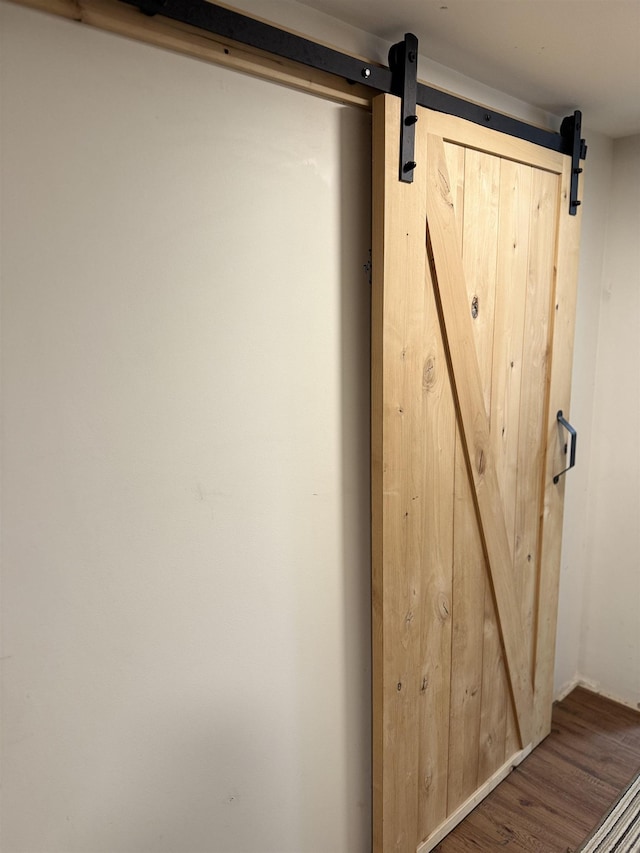 9 Spruce Rd, Middleton, NH 03887 - detailed view of a barn door and wood finished floors