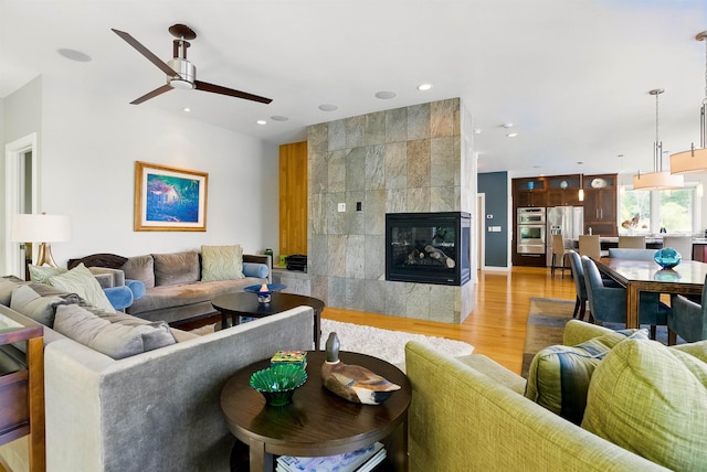 25 N Shore Rd, Windham, NH 03087 - living room featuring a ceiling fan, light wood-type flooring, recessed lighting, and a tile fireplace