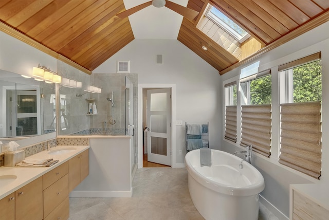 25 N Shore Rd, Windham, NH 03087 - full bathroom with a stall shower, a freestanding tub, double vanity, a skylight, and high vaulted ceiling