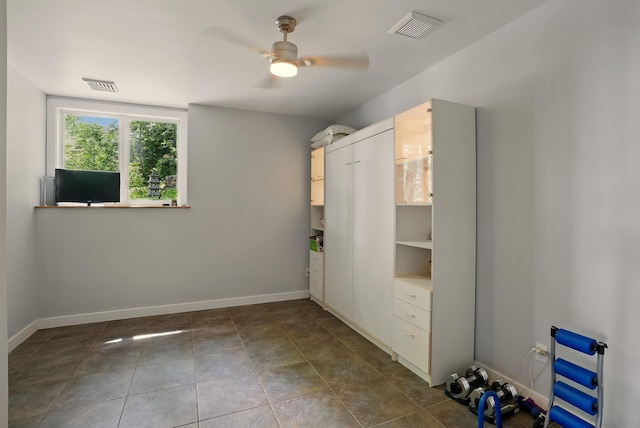 25 N Shore Rd, Windham, NH 03087 - empty room featuring ceiling fan, baseboards, and dark tile patterned floors