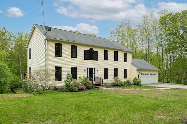 105 Fall Mill Rd, York, ME 03909 - colonial-style house featuring a garage, concrete driveway, a front lawn, and a shingled roof