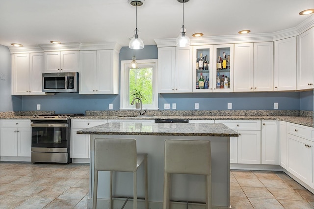 105 Fall Mill Rd, York, ME 03909 - kitchen featuring stainless steel appliances, a sink, white cabinetry, hanging light fixtures, and recessed lighting