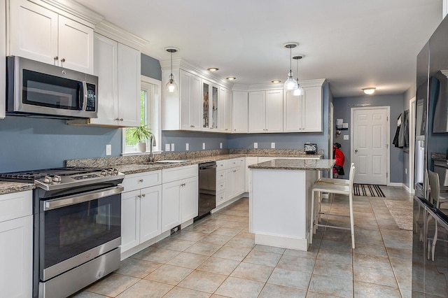 105 Fall Mill Rd, York, ME 03909 - kitchen featuring appliances with stainless steel finishes, a sink, and white cabinets