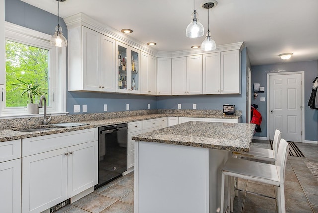 105 Fall Mill Rd, York, ME 03909 - kitchen with black dishwasher, a sink, white cabinets, a kitchen bar, and recessed lighting