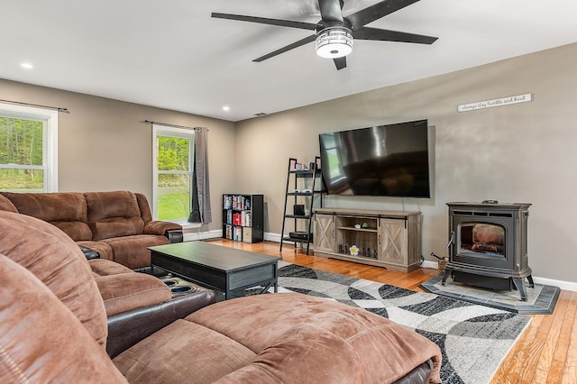 105 Fall Mill Rd, York, ME 03909 - living area with healthy amount of natural light, hardwood / wood-style floors, a wood stove, a ceiling fan, and recessed lighting