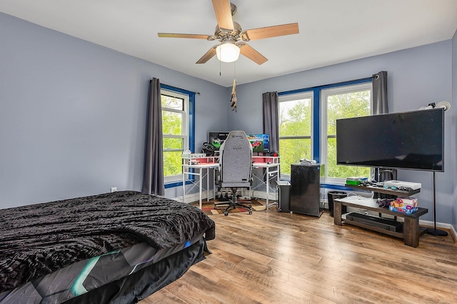 105 Fall Mill Rd, York, ME 03909 - bedroom with wood finished floors, a ceiling fan, a desk, and baseboards