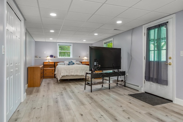 105 Fall Mill Rd, York, ME 03909 - bedroom with light wood-type flooring, a drop ceiling, baseboard heating, baseboards, and recessed lighting