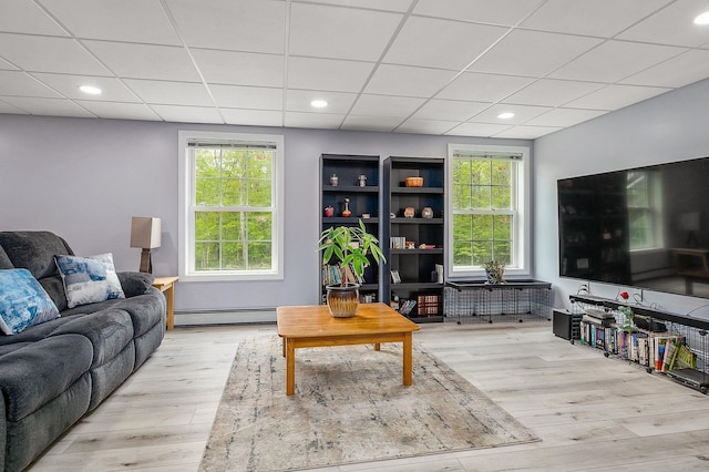 105 Fall Mill Rd, York, ME 03909 - living area with a baseboard heating unit, wood finished floors, recessed lighting, and a paneled ceiling