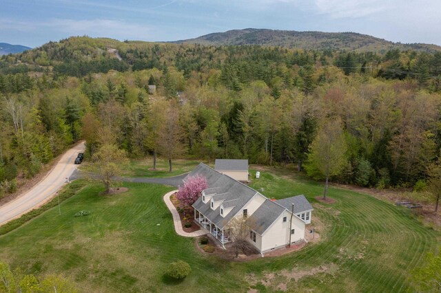 104 Champagne Cir, Campton, NH 03223 - aerial view of property and surrounding area with a heavily wooded area and a mountain backdrop
