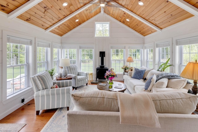 104 Champagne Cir, Campton, NH 03223 - living area featuring a wood stove, wood finished floors, wood ceiling with exposed beams, recessed lighting, and high vaulted ceiling