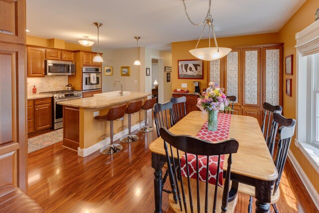 104 Champagne Cir, Campton, NH 03223 - dining area with light wood-style floors and baseboards