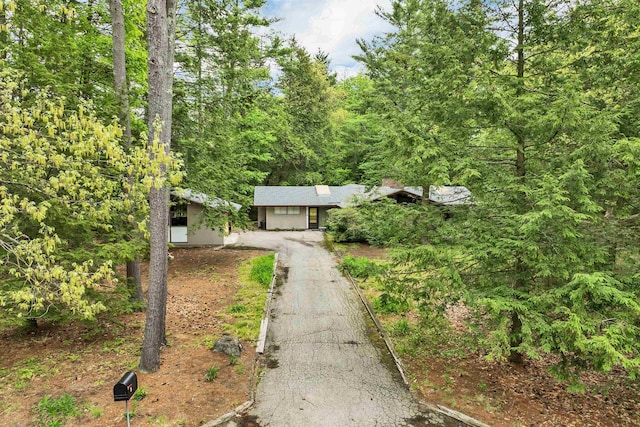25 Wendover Way, Bedford, NH 03110 - view of front facade with driveway and a view of trees