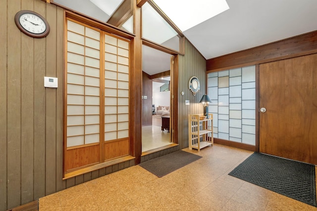 25 Wendover Way, Bedford, NH 03110 - entrance foyer featuring tile patterned floors, wooden walls, and a skylight