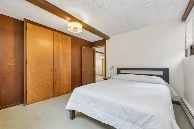 25 Wendover Way, Bedford, NH 03110 - bedroom with a baseboard heating unit, a closet, and a textured ceiling
