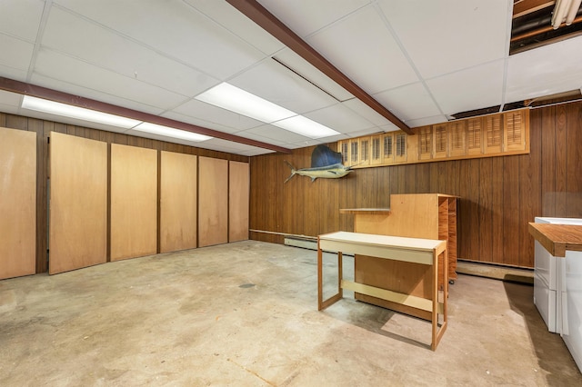 25 Wendover Way, Bedford, NH 03110 - finished below grade area featuring wood walls, baseboard heating, and a paneled ceiling