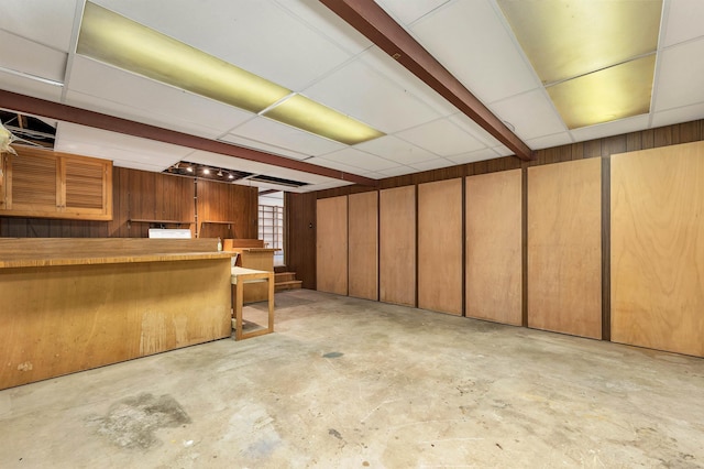 25 Wendover Way, Bedford, NH 03110 - finished basement featuring stairway, a paneled ceiling, and wooden walls