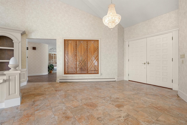 43 Sterling Pl, Bow, NH 03304 - entrance foyer with a baseboard heating unit, a chandelier, high vaulted ceiling, stone finish floors, and baseboards