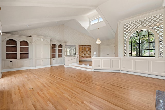 43 Sterling Pl, Bow, NH 03304 - unfurnished living room featuring light wood finished floors, high vaulted ceiling, and baseboard heating