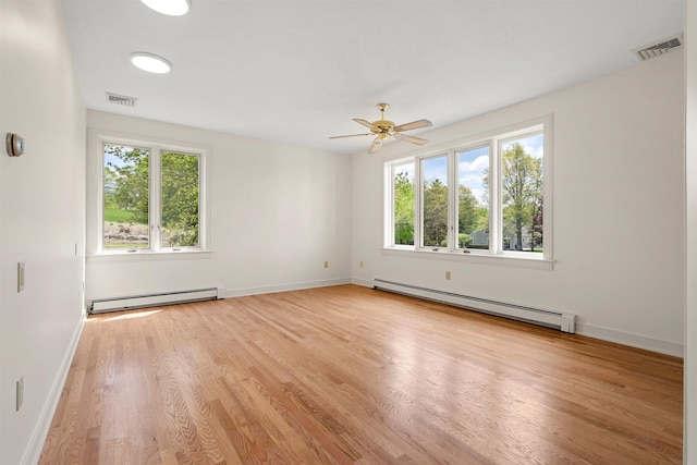 43 Sterling Pl, Bow, NH 03304 - spare room featuring baseboard heating, light wood-type flooring, a ceiling fan, and baseboards