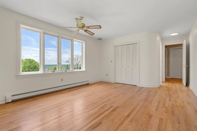 43 Sterling Pl, Bow, NH 03304 - unfurnished bedroom with a baseboard radiator, light wood-style floors, a closet, and baseboards