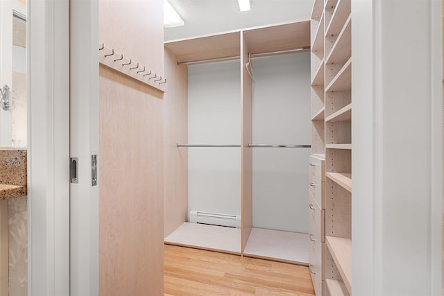 43 Sterling Pl, Bow, NH 03304 - spacious closet featuring baseboard heating and light wood finished floors