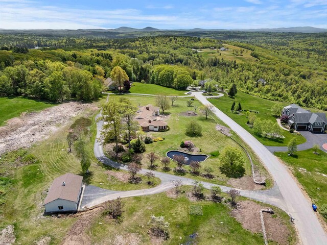 43 Sterling Pl, Bow, NH 03304 - aerial view of property and surrounding area with a heavily wooded area and a mountain backdrop