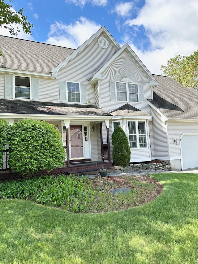 8 Heathrow Ct, Nashua, NH 03063 - traditional-style home featuring a garage, covered porch, and a front lawn