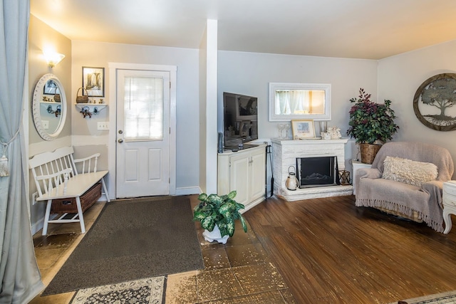 141 Hemmsted Cir # 6, Castleton, VT 05732 - living area with a fireplace with raised hearth and dark wood-style floors