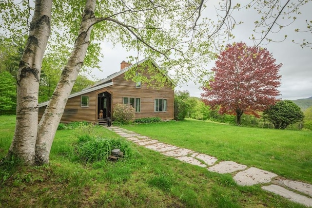 216 Rocky Rd, Rochester, VT 05767 - view of front facade with a chimney and a front lawn