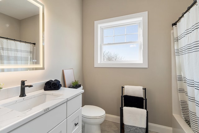 10100 S Willow St Unit 114, Manchester, NH 03103 - bathroom with vanity, toilet, baseboards, and tile patterned floors