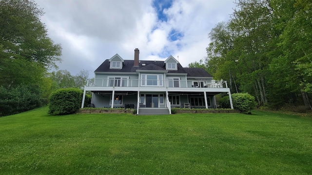 45 Deacon Willey Rd, Campton, NH 03223 - back of house with a chimney, a lawn, a deck, and a balcony