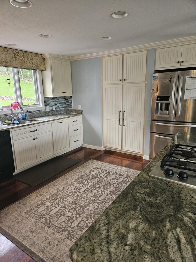 45 Deacon Willey Rd, Campton, NH 03223 - kitchen with stainless steel appliances, a sink, cream cabinetry, dark wood-style floors, and recessed lighting