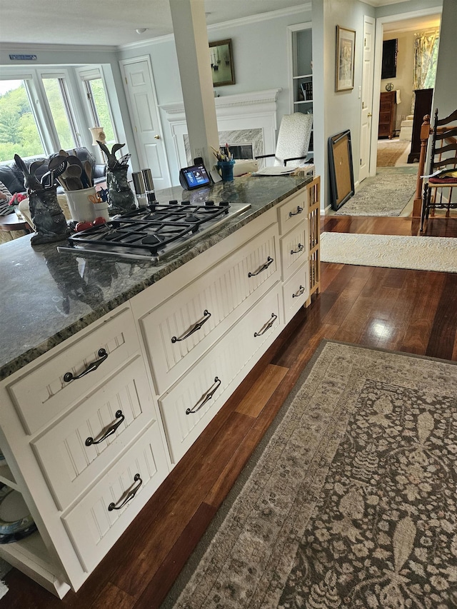 45 Deacon Willey Rd, Campton, NH 03223 - kitchen with open floor plan, ornamental molding, dark wood finished floors, a fireplace, and dark stone counters