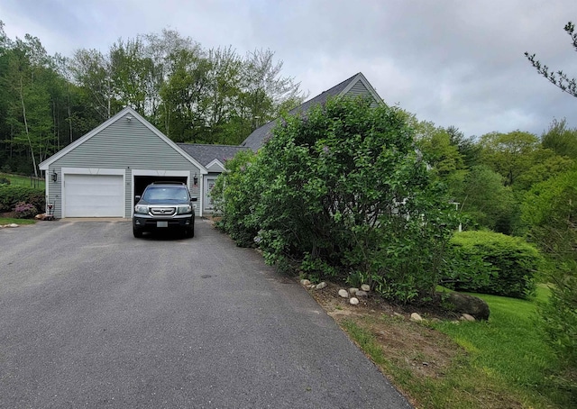 45 Deacon Willey Rd, Campton, NH 03223 - view of front of house with driveway, a shingled roof, and a garage