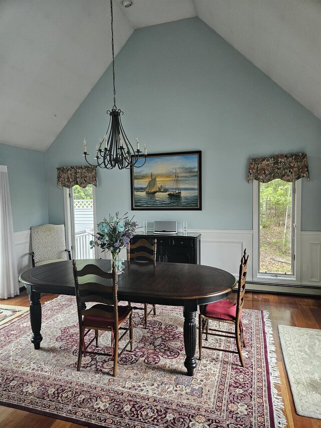 45 Deacon Willey Rd, Campton, NH 03223 - dining space featuring wainscoting, wood finished floors, a chandelier, high vaulted ceiling, and baseboard heating