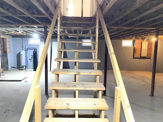 32 Henry Taylor St, Salem, NH 03079 - below grade area with electric panel, stairway, and water heater