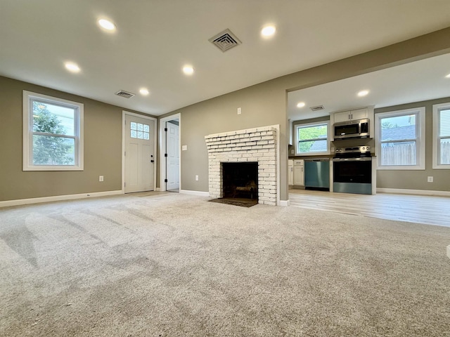 3 Lyndale Ave, Salem, NH 03079 - unfurnished living room featuring baseboards, a fireplace, light carpet, and recessed lighting