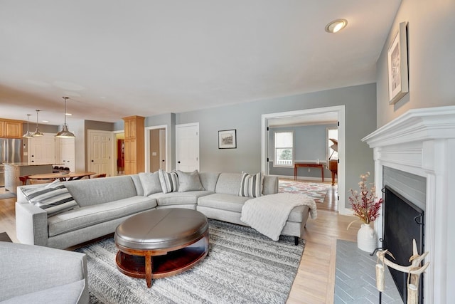 155 Middle Rd, Brentwood, NH 03833 - living room with light wood-style flooring, recessed lighting, a fireplace with flush hearth, and baseboards