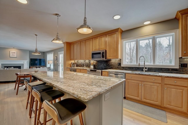 155 Middle Rd, Brentwood, NH 03833 - kitchen with a sink, appliances with stainless steel finishes, decorative backsplash, plenty of natural light, and recessed lighting