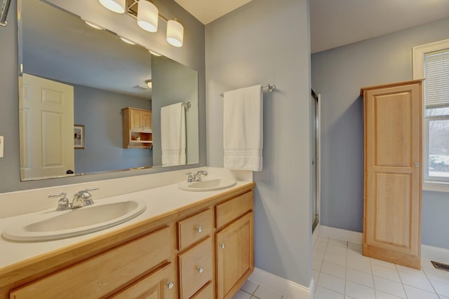 155 Middle Rd, Brentwood, NH 03833 - full bathroom with tile patterned floors, double vanity, an enclosed shower, and baseboards